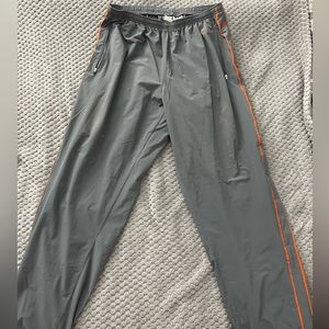 Men’s 2000's Nike Fit Gray with orange Striped Side Track Pants.